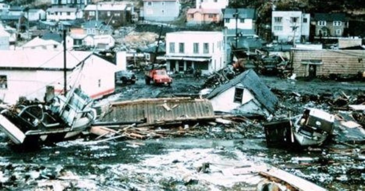 Collapsed buildings, wrecked vehicles and scattered debris fill downtown Crescent City after the March 1964 tsunami.